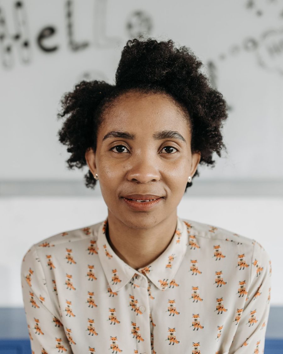 Portrait of a smiling woman in a patterned blouse